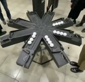 16 balls moving in perfect synchronicity