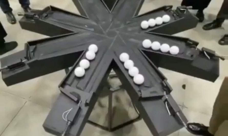 16 balls moving in perfect synchronicity