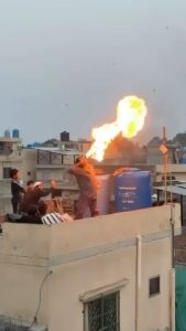 A fire breathing stunt goes wrong on a rooftop.