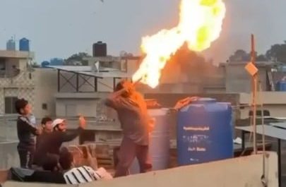 A fire breathing stunt goes wrong on a rooftop.