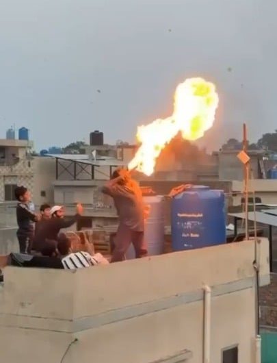 A fire breathing stunt goes wrong on a rooftop.