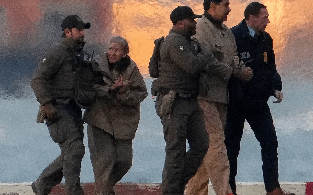 A photo of Maduro and his wife taken while they were being taken to a US court.