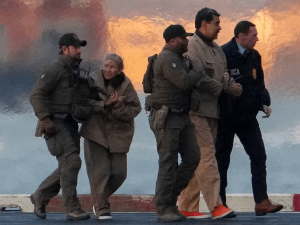 A photo of Maduro and his wife taken while they were being taken to a US court.