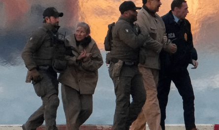 A photo of Maduro and his wife taken while they were being taken to a US court.