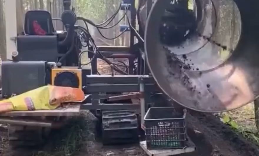 A rotary trommel machine separating worms from soil