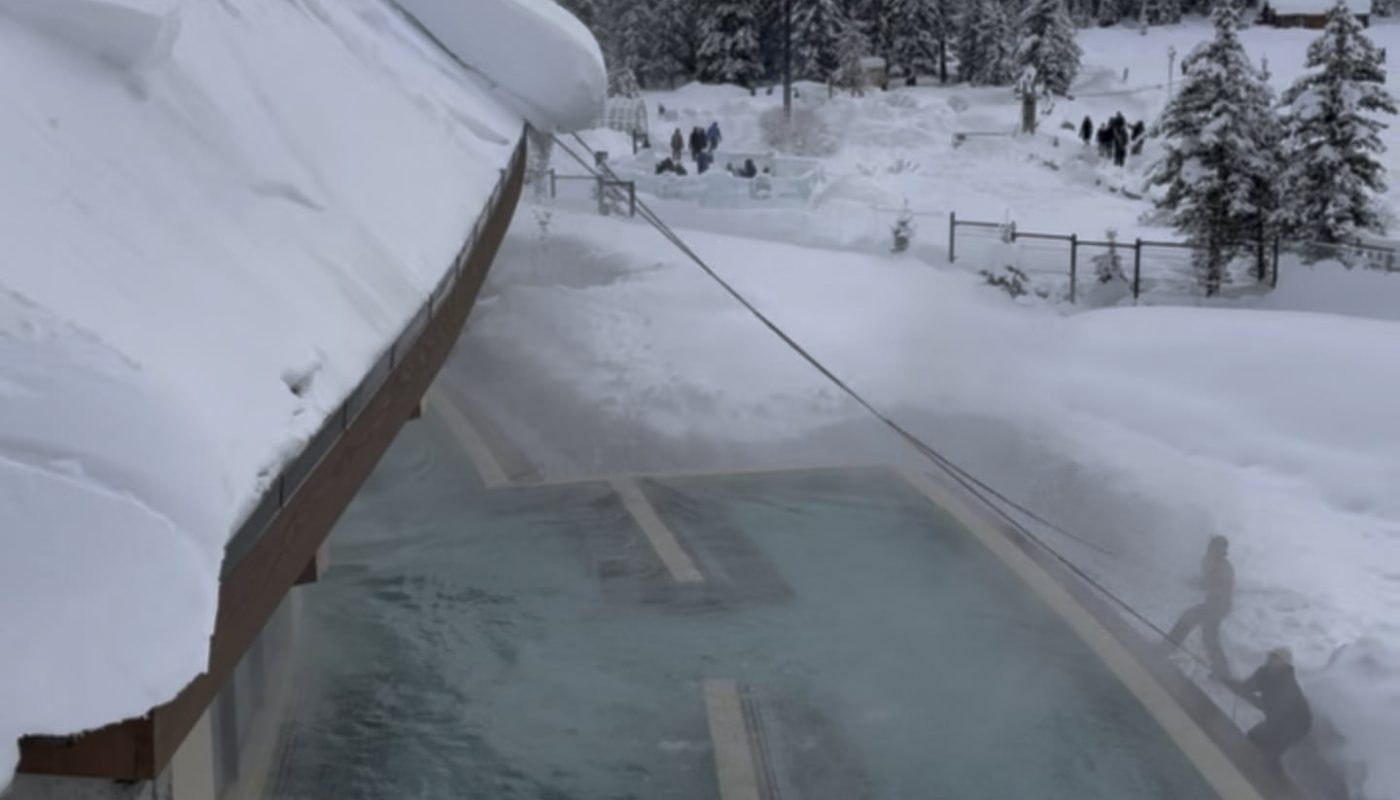 Cutting dangerous snow from an edge.