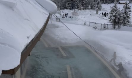 Cutting dangerous snow from an edge.