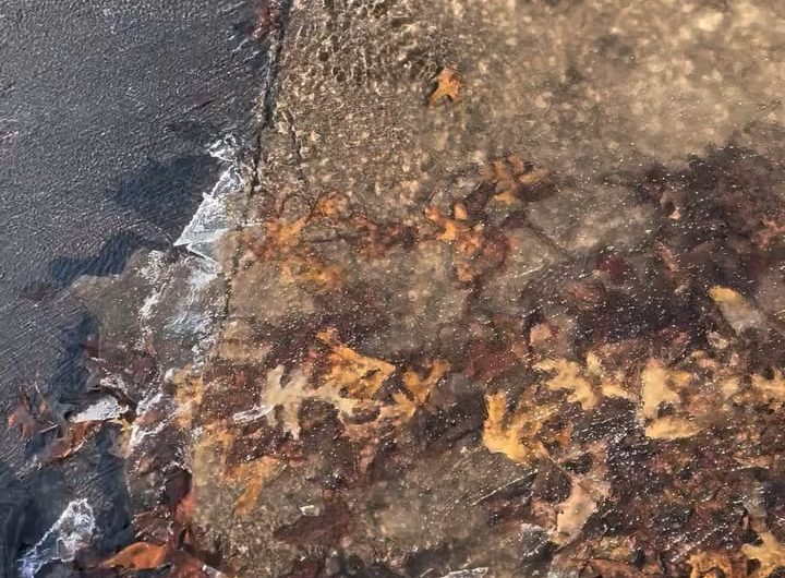 Ice breaking off the surface of a water stream