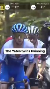 Identical twin pro cyclists Adam and Simon Yates cycling up a hill.
