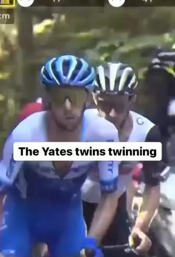 Identical twin pro cyclists Adam and Simon Yates cycling up a hill.