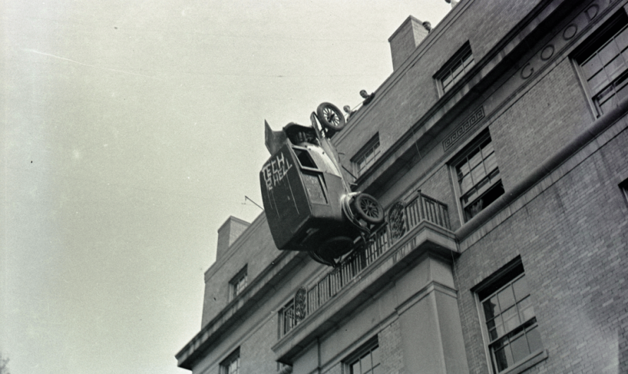 In 1936 some students pranked the MIT institute by puting a car up and in the side of the building with a colorful message. Source in comment.