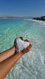 In the Dead Sea, there is an entire beach full of round salt pearls that look like white sand.