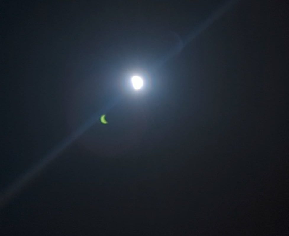 Reflection shows clear view of solar eclipse