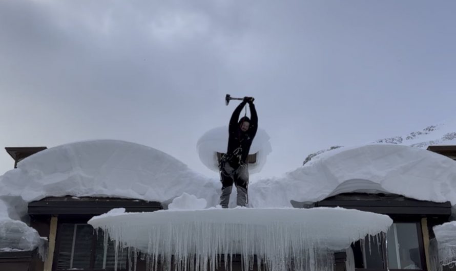 Removing ice from a Canadian roof.