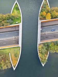 The Veluwemeer Aquaduct in Netherlands, is one of 41 water bridges in the country letting boats pass over the road while vehicles drive safely below