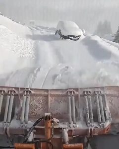 The quiet rhythm of a snowplough.