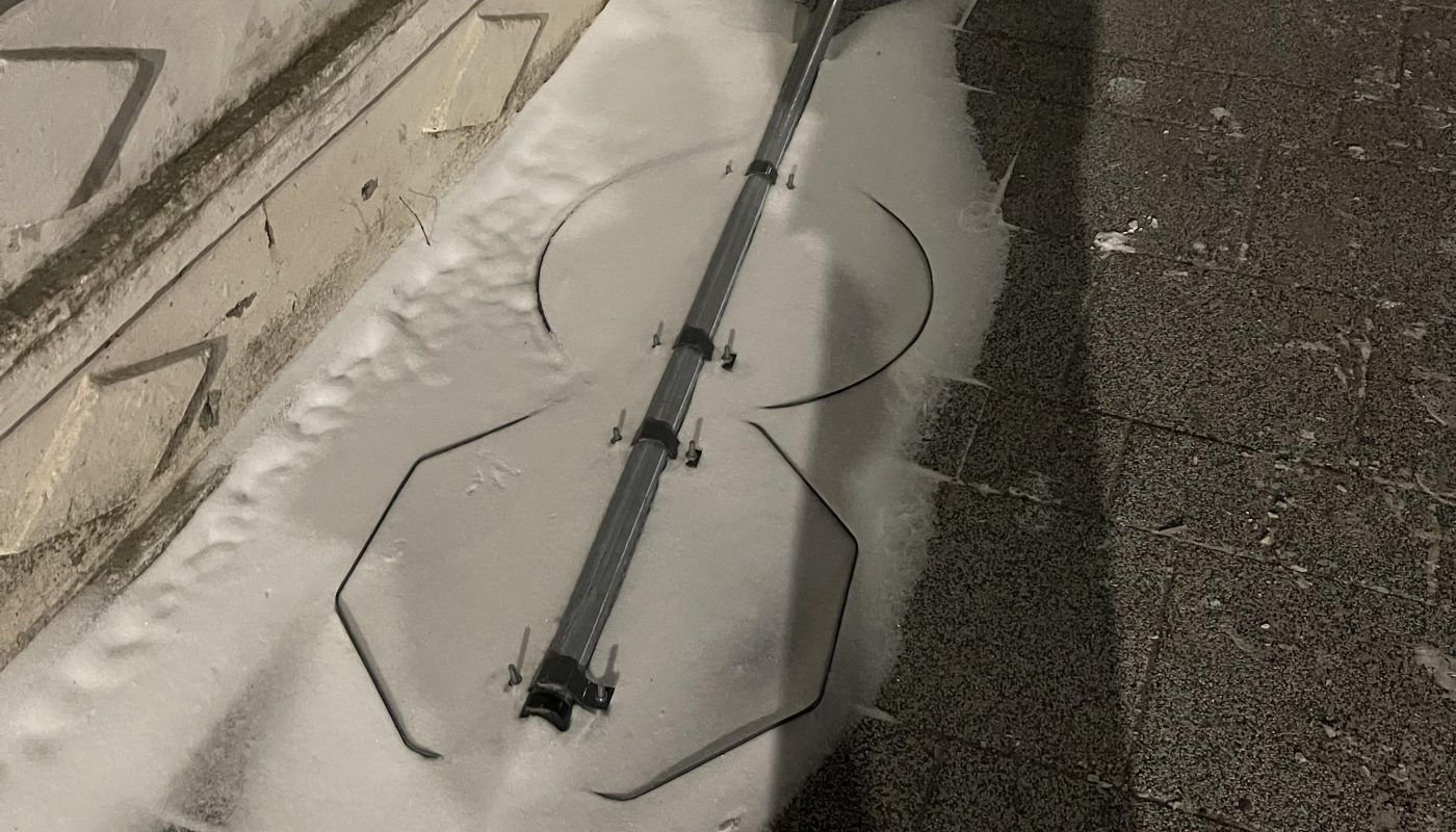 This fallen sign covered in snow