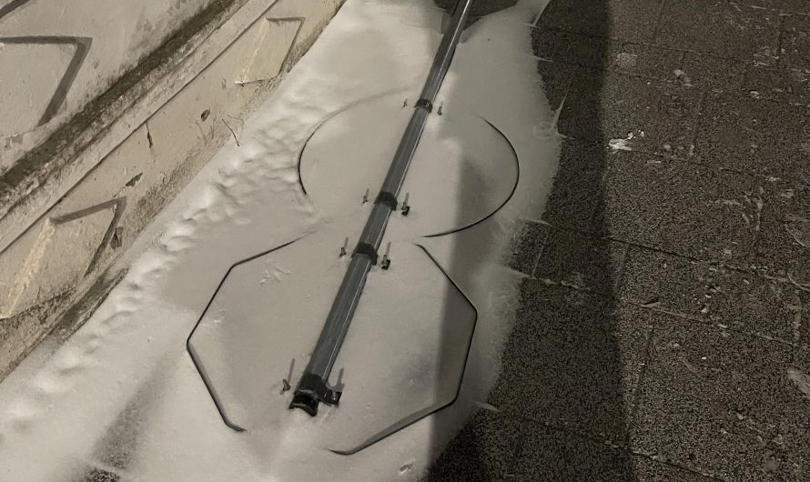 This fallen sign covered in snow