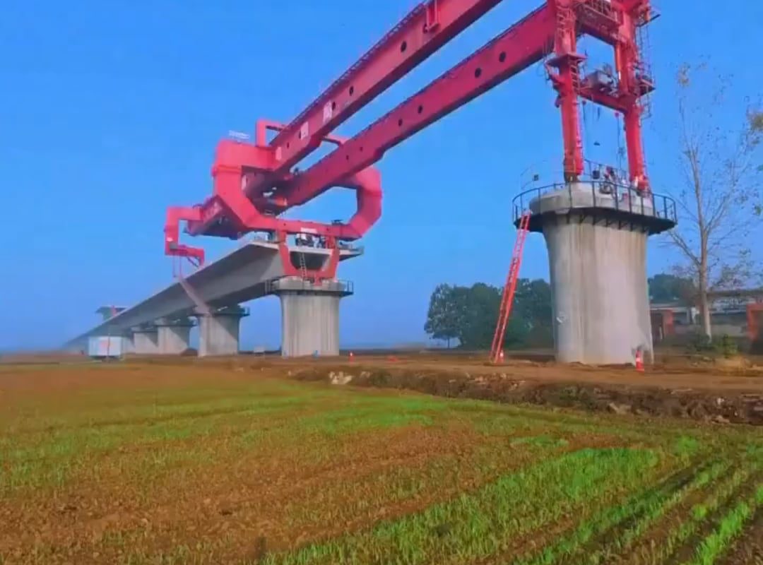This is a bridge girder machine which is used by construction crews to individually place blocks of concrete during the development process