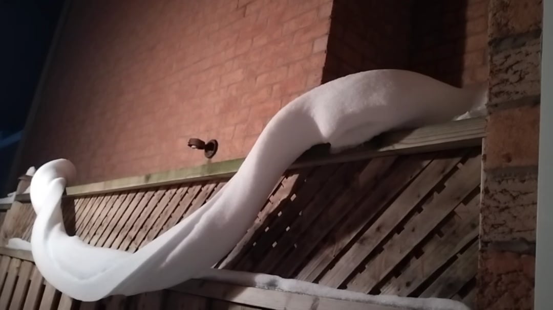 Twisted Snow Ribbon on Our Fence