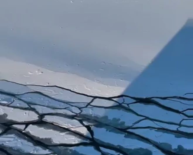 Waves caused by the ship’s movement break the ice layer