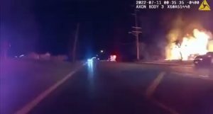 25 year old pizza delivery driver, Nick Bostic, runs into a burning house and saves four children who tell him another might be in the house. He goes back in, finds the girl, jumps out a window with her and carries her to a cop who captures the moment on his bodycam