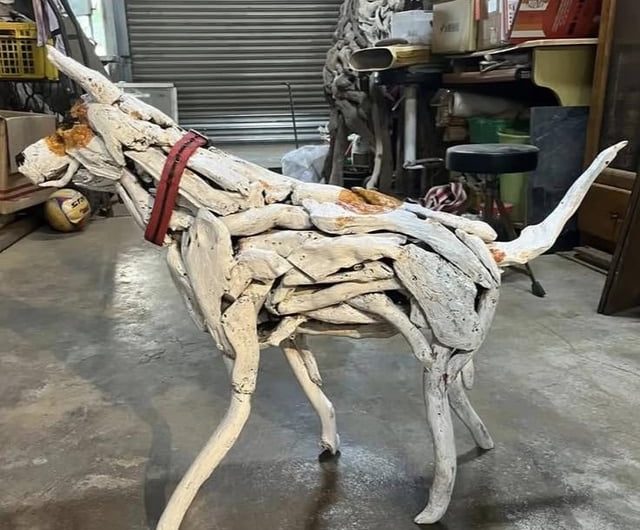 A Taiwanese artist sculpted his late dog using the driftwood they collected over the years together :)