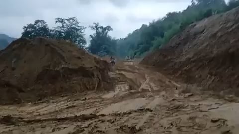 A biker narrowly escapes as a massive landslide blocks the Siji River in Arunachal Pradesh, India – June 28, 2026
