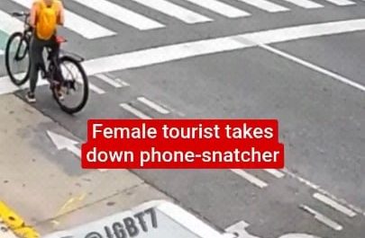 A female tourist in Buenos Aires takes down a phone snatcher and holds him down. Eventually, the police arrives and takes him away.