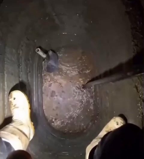 A really deep well, so deep it even have its own micro climate (the fog below).