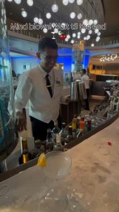 A waiter does a magic trick for the cherries.