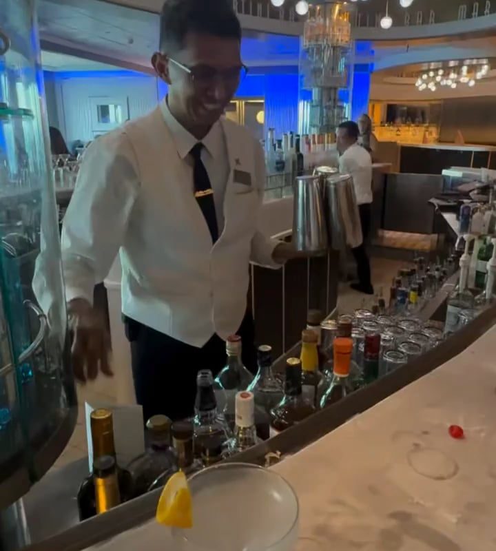 A waiter does a magic trick for the cherries.