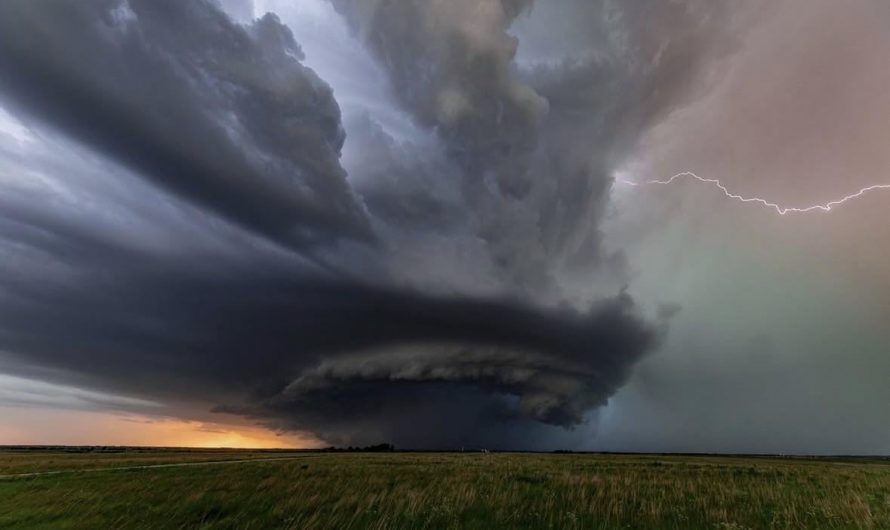 An ominous supercell storm rotating over a Kansas prairie