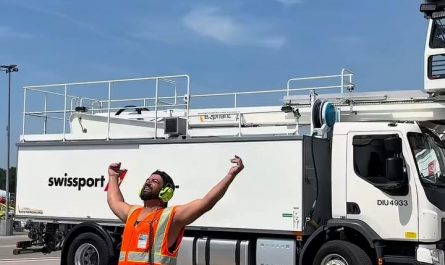 Apron crew at Zurich airport cooling off with a deicing shower