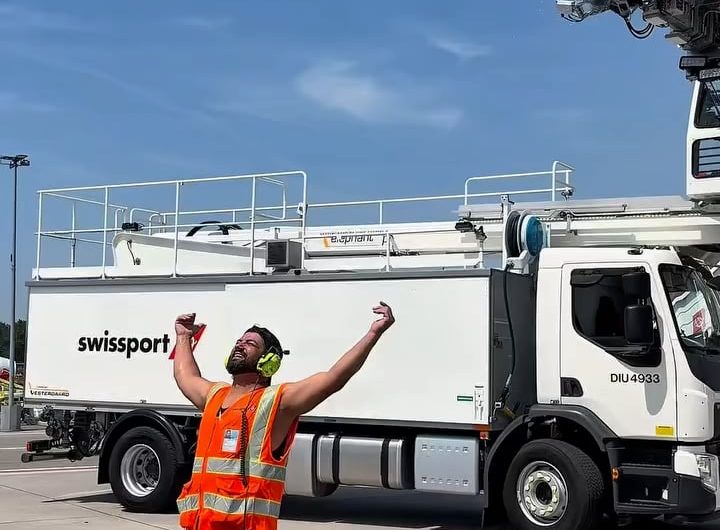 Apron crew at Zurich airport cooling off with a deicing shower