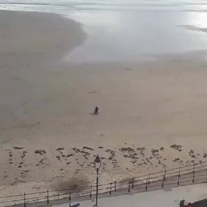 Banksy piece drawn on a beach in Scarborough