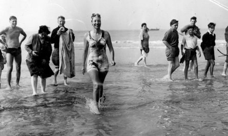 Champion swimmer Florence Chadwick comes out of the water and becomes the fastest time crossing the english channel at 13hr and 23min. 8 of August 1950.