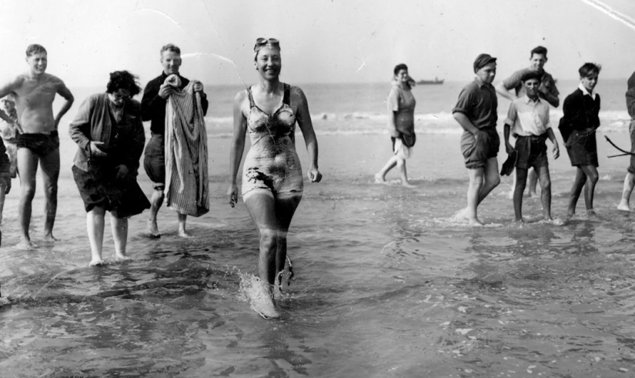 Champion swimmer Florence Chadwick comes out of the water and becomes the fastest time crossing the english channel at 13hr and 23min. 8 of August 1950.
