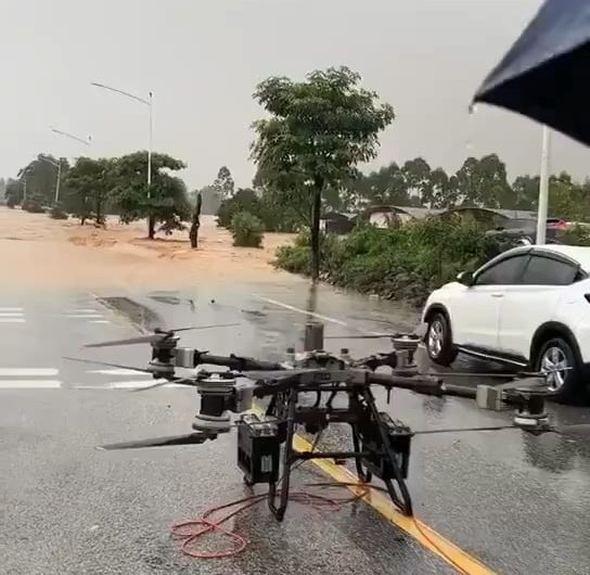 China using drones to rescue people from deadly floods that have killed at least 17 people.