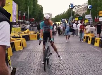 Cracking open a beer with your bike right after finishing the Tour de France