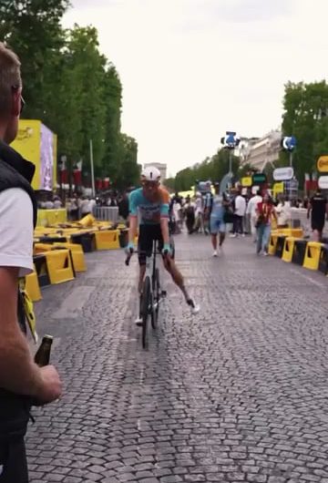 Cracking open a beer with your bike right after finishing the Tour de France