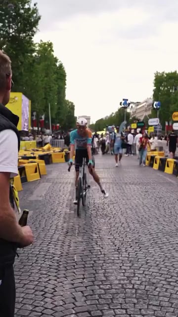 Cracking open a beer with your bike right after finishing the Tour de France