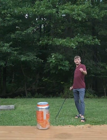 Cracking soda pop can with a wip