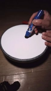 Creating a concentric marker pattern on a rotating surface
