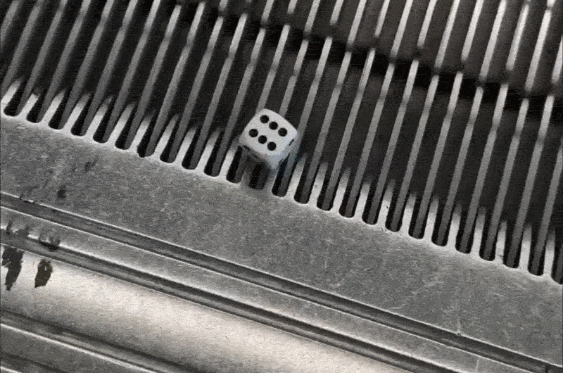 Dice stuck on the top step of an escalator