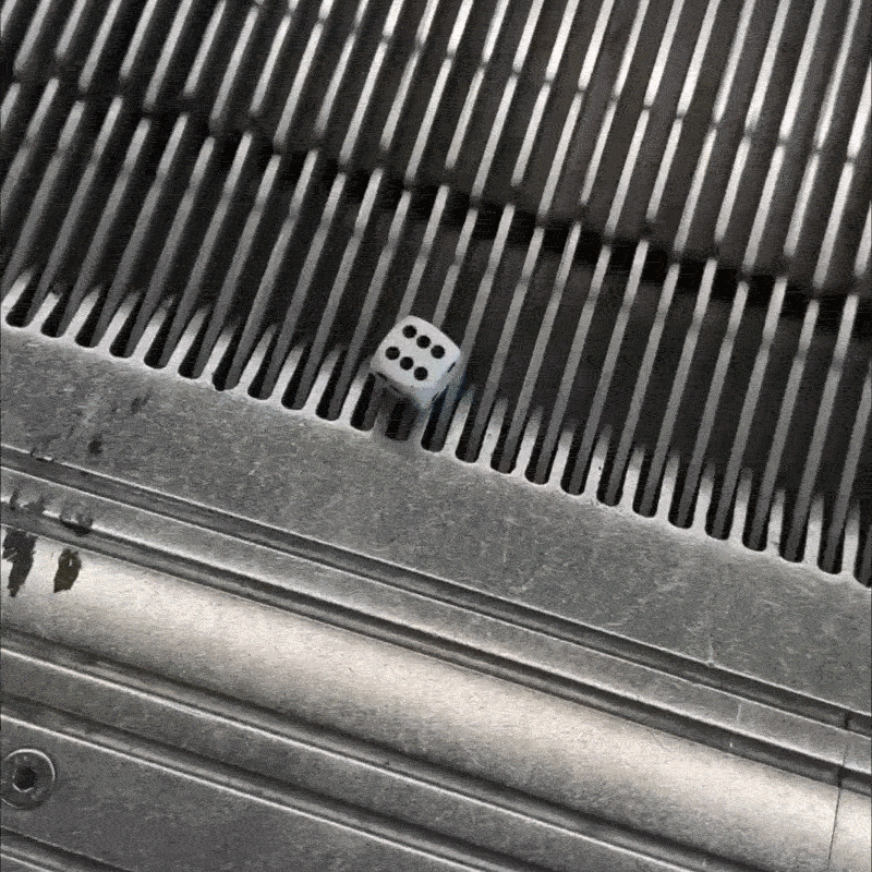 Dice stuck on the top step of an escalator