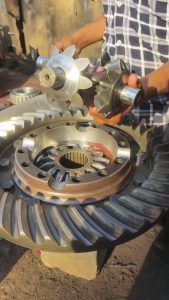 Differential gears reassembled, lubed, and spun 'al fresco' by a smooth operator