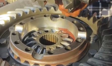 Differential gears reassembled, lubed, and spun 'al fresco' by a smooth operator