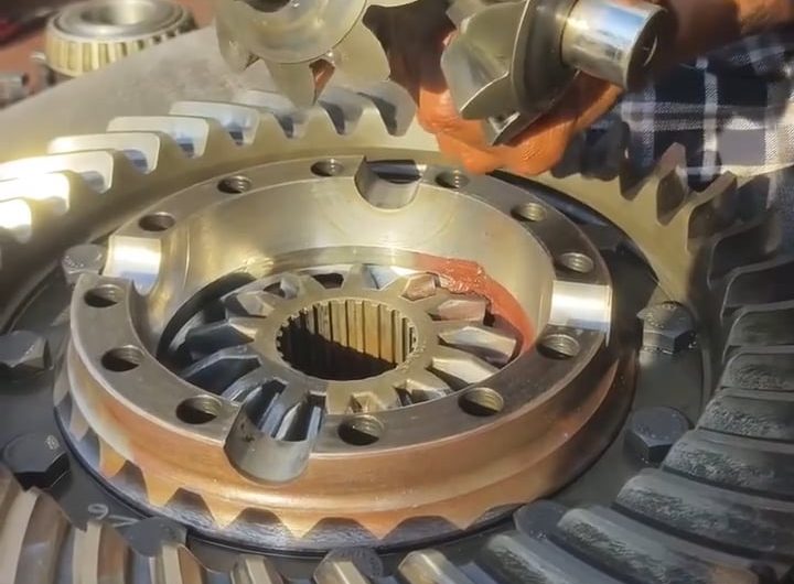 Differential gears reassembled, lubed, and spun ‘al fresco’ by a smooth operator