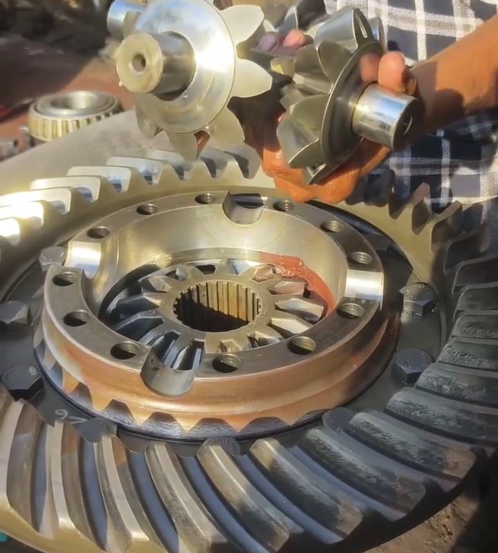 Differential gears reassembled, lubed, and spun 'al fresco' by a smooth operator